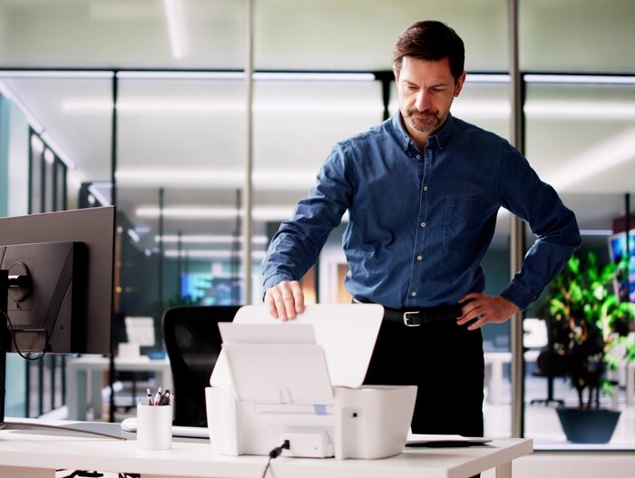 Man using a document scanner