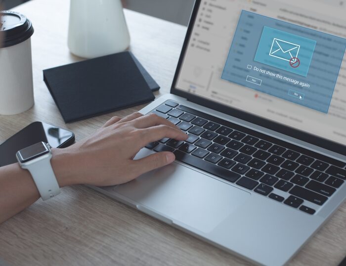person blocking a spam email