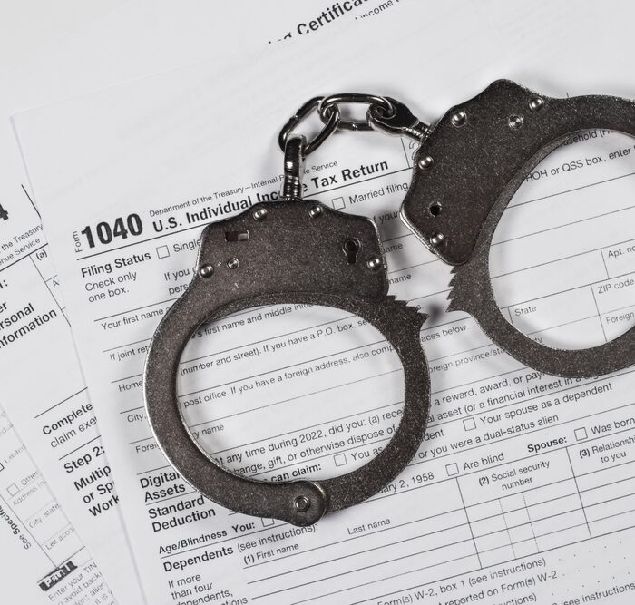 handcuffs on a tax return document