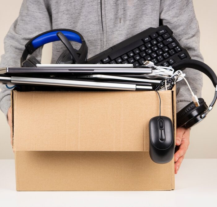 cardboard box full of computer equipment