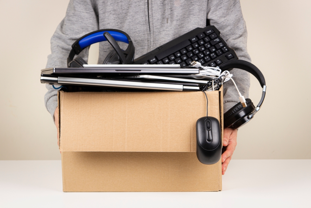 cardboard box full of computer equipment