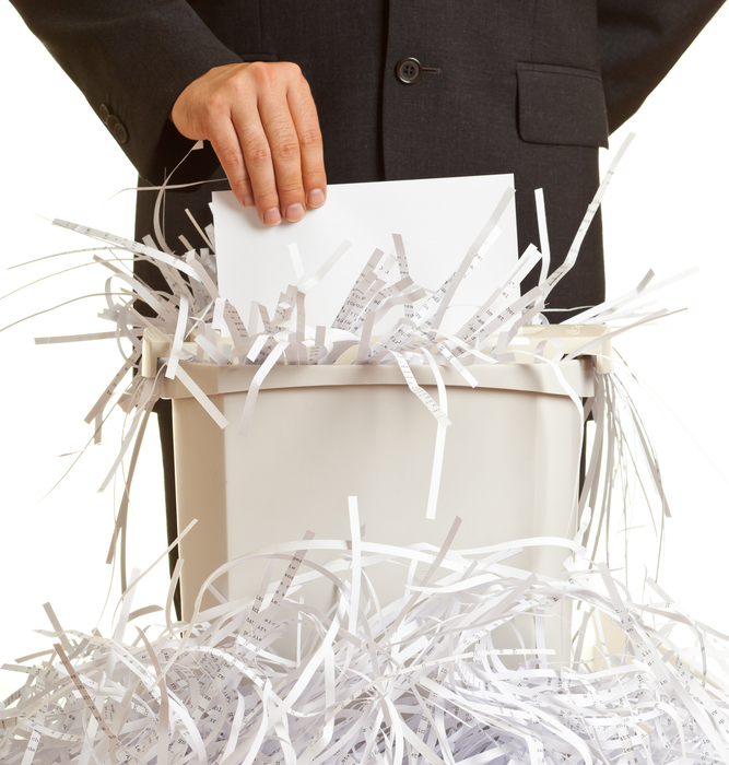 person shredding paper