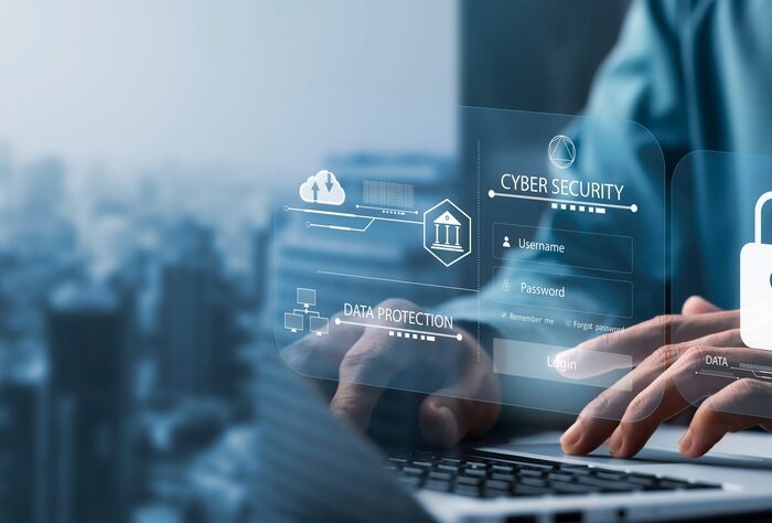 cybersecurity graphic over a laptop