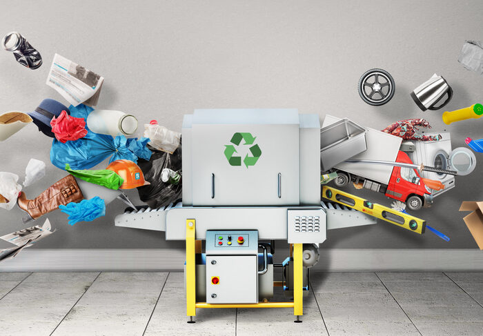 products being fed into a recycling machine