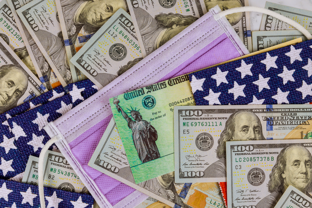 U.S. currency and a surgical mask