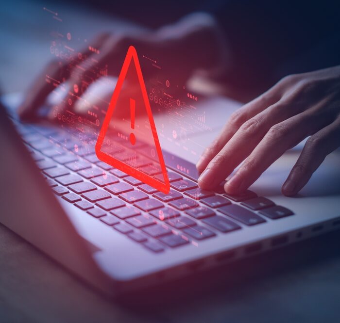 system hacked warning over a laptop