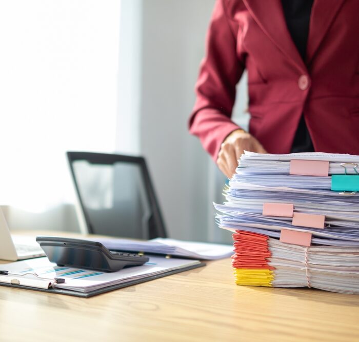 pile of tax documents on a desk