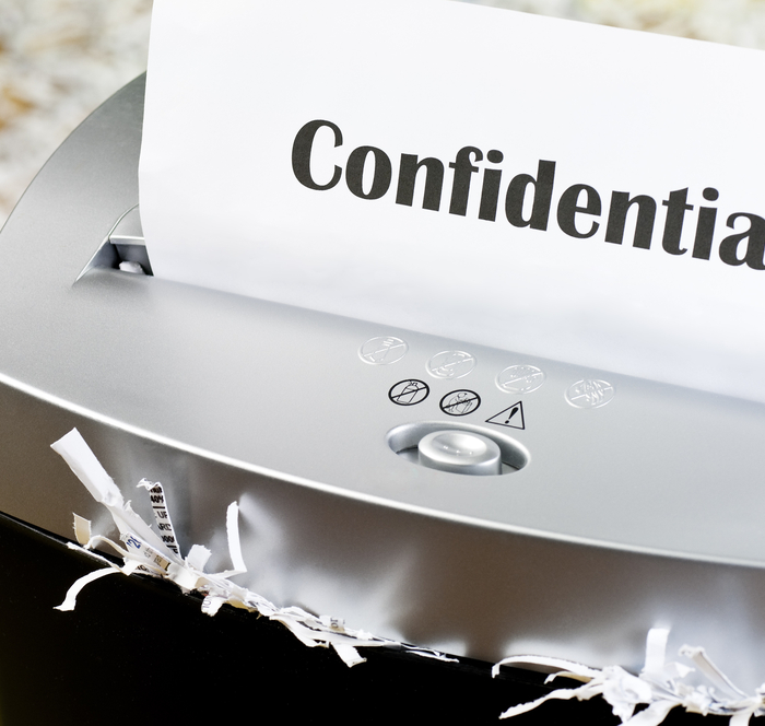 confidential document being shredded