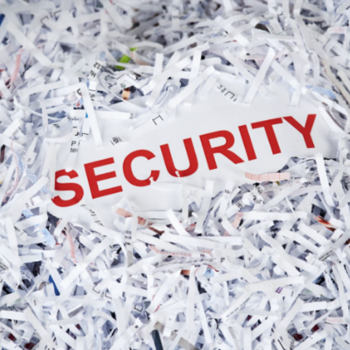 the text "security" in a pile of shredded paper