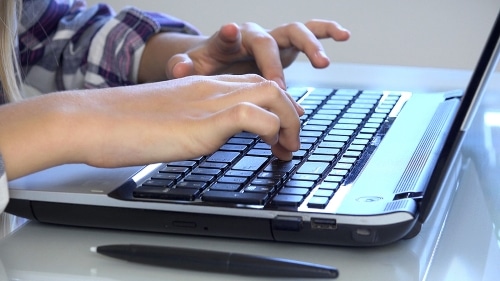 Child Browsing Internet on Laptop
