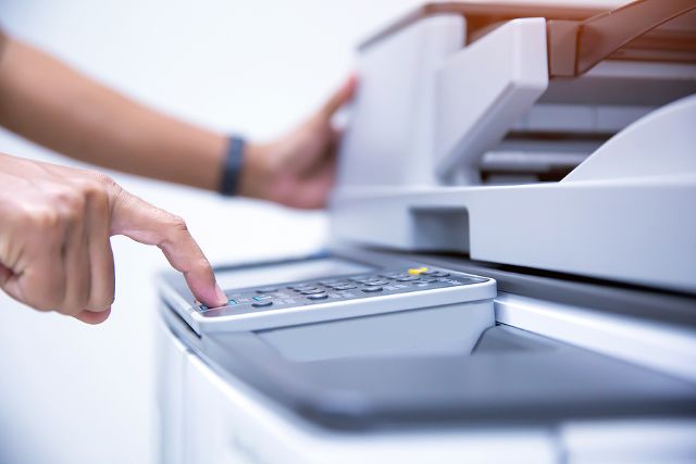 Copier printer, Close up hand office man press copy button on panel to using the copier or photocopier machine for scanning document printing a sheet paper and xerox photocopy.